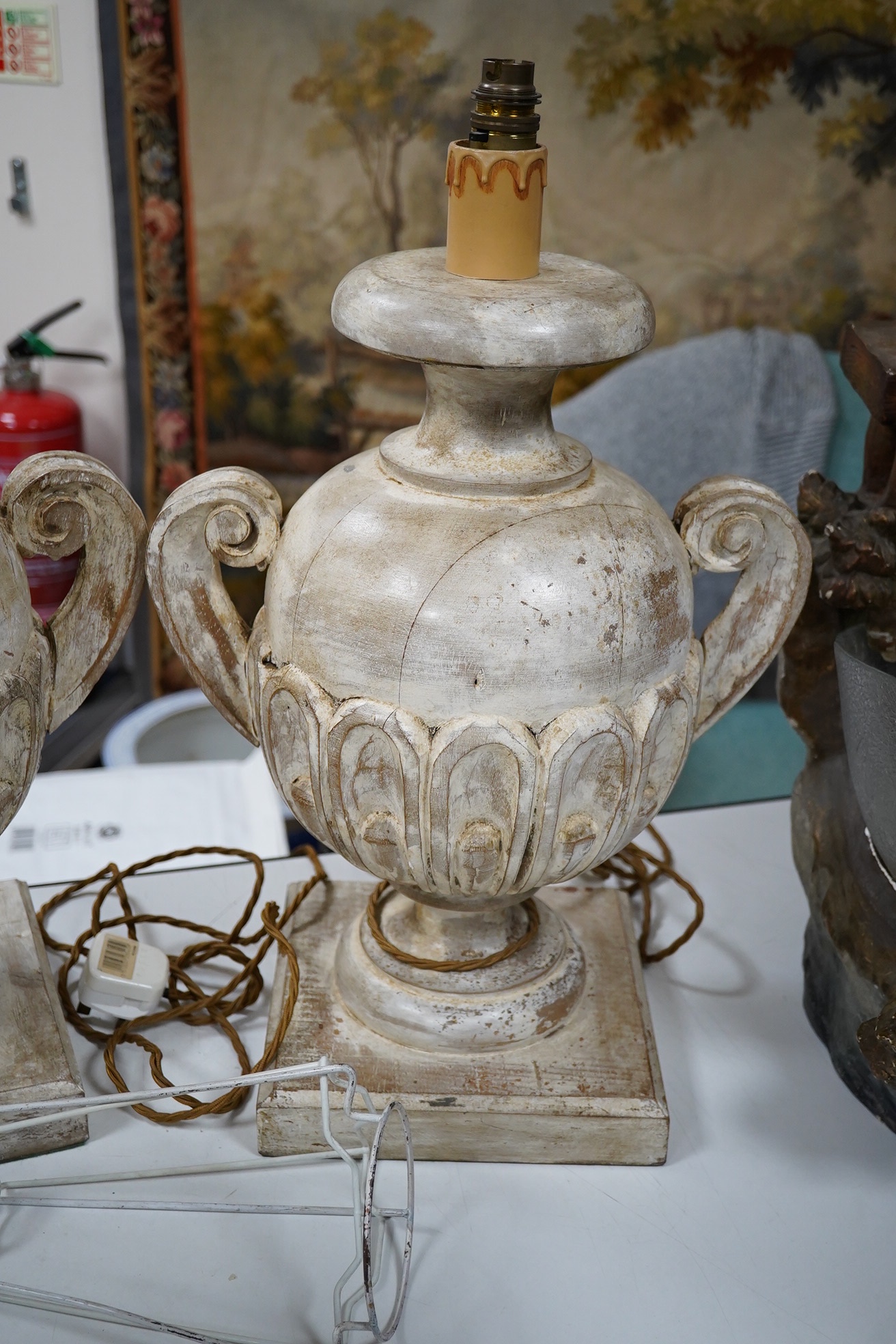 A pair of carved and painted wood table lamps, 44cm excluding fittings. Condition - fair to good, not tested